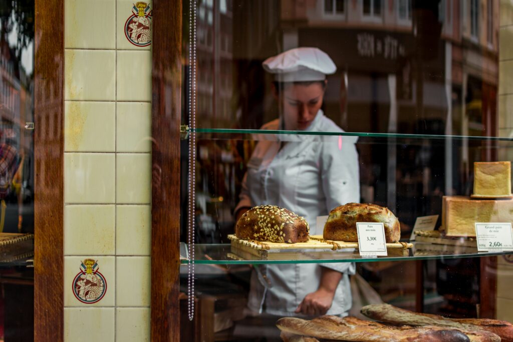 Chef looking at pastries in a French bakery