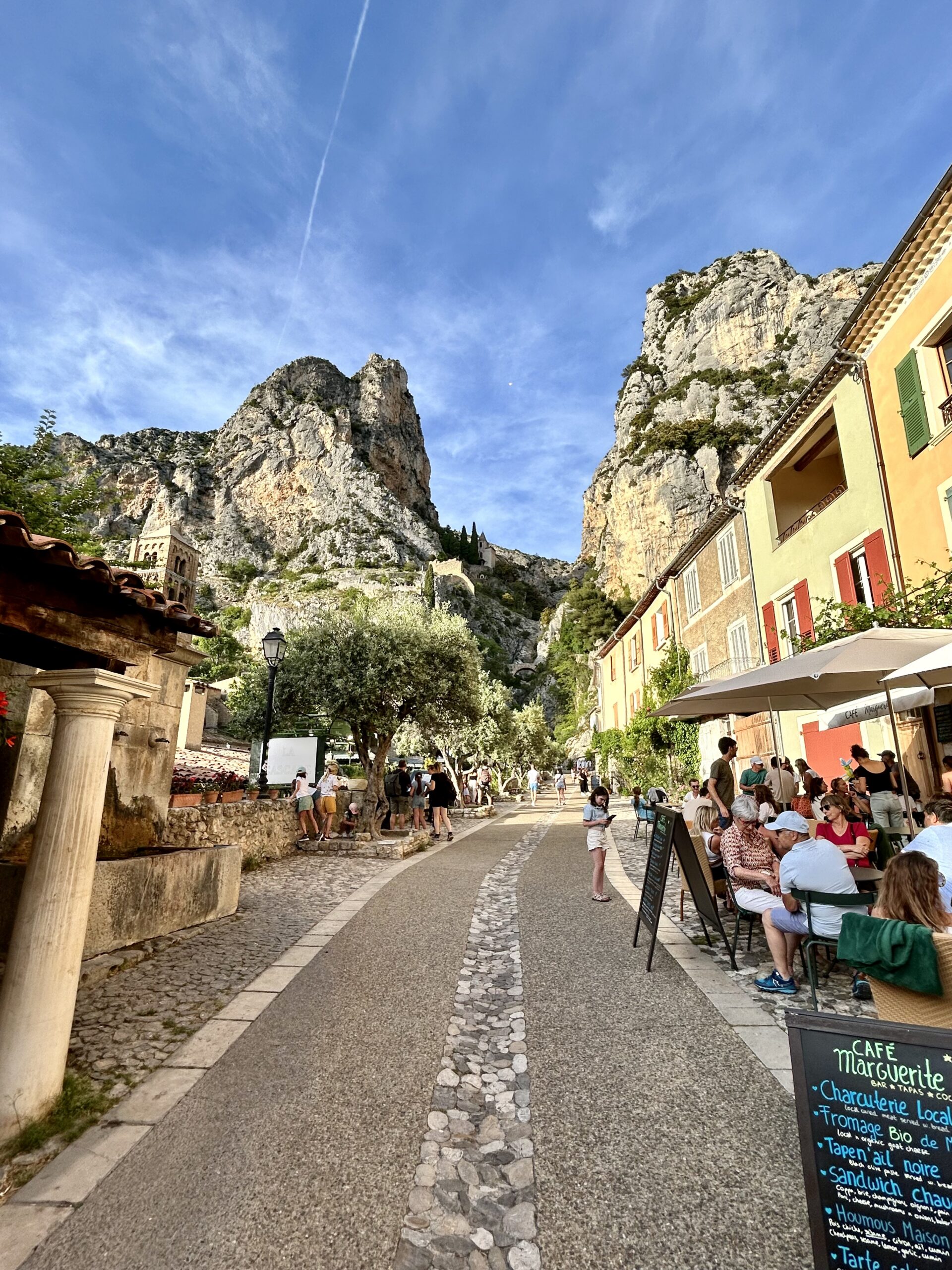 Cafe in a small French village surrounded by cliffs