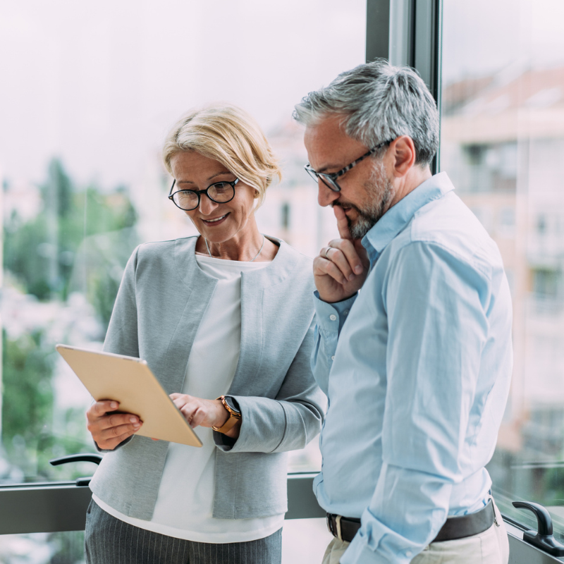 Wealthy couple looking at financial documents