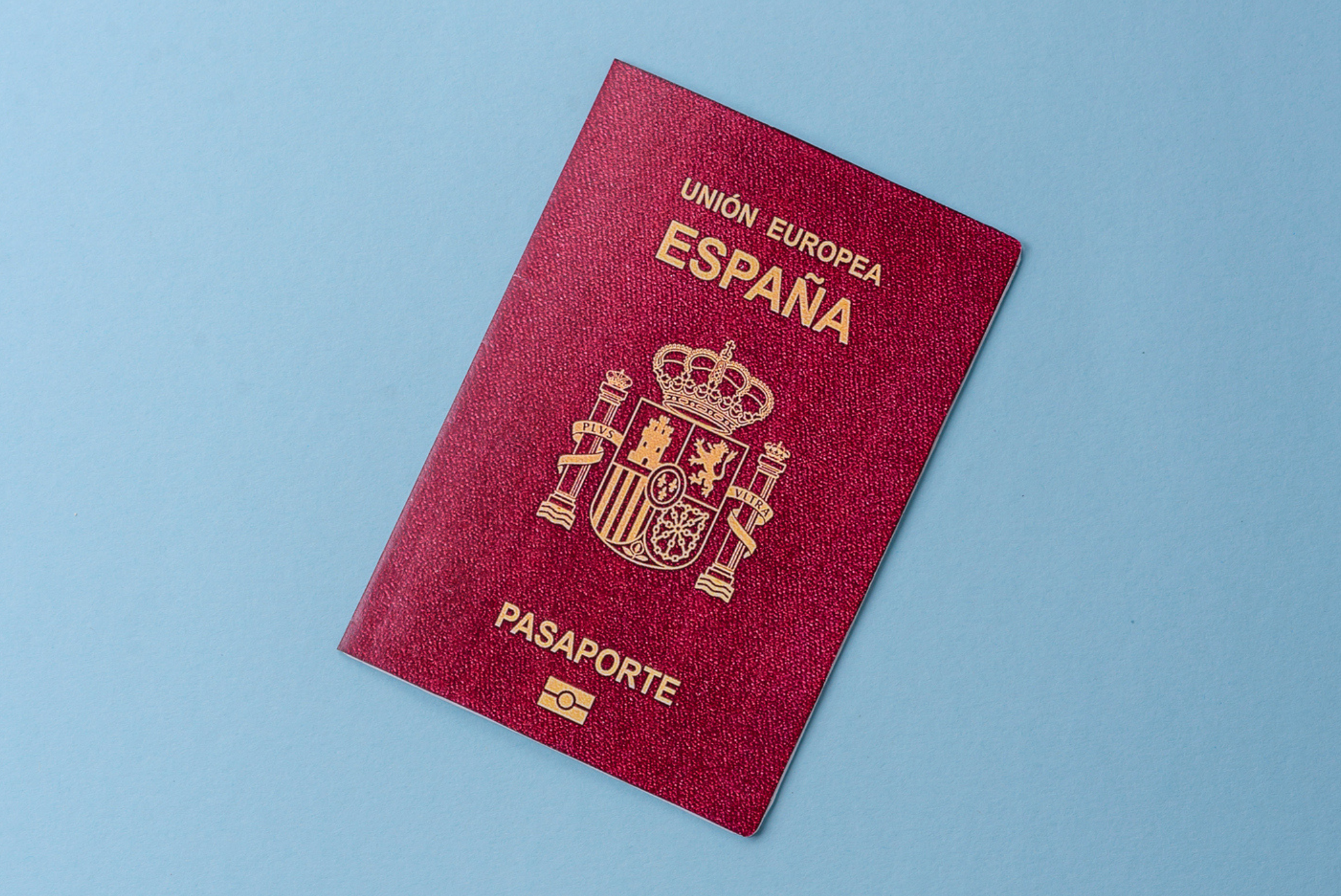 Spanish passport set against a blue background