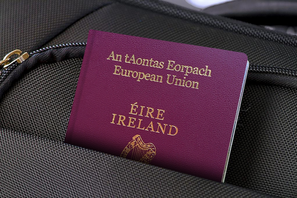 Irish passport tucked into a laptop bag