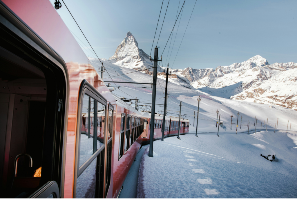 View from the window of the red train traveling towards the Matterhorn