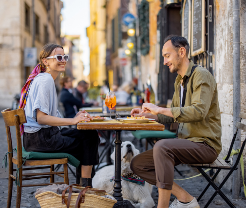 Couple eating at an Italian street cafe