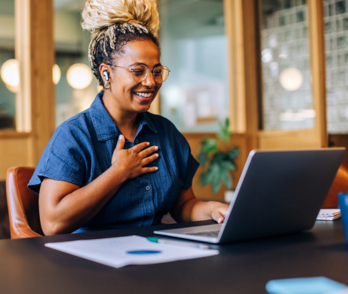 Woman talking on her laptop smiling