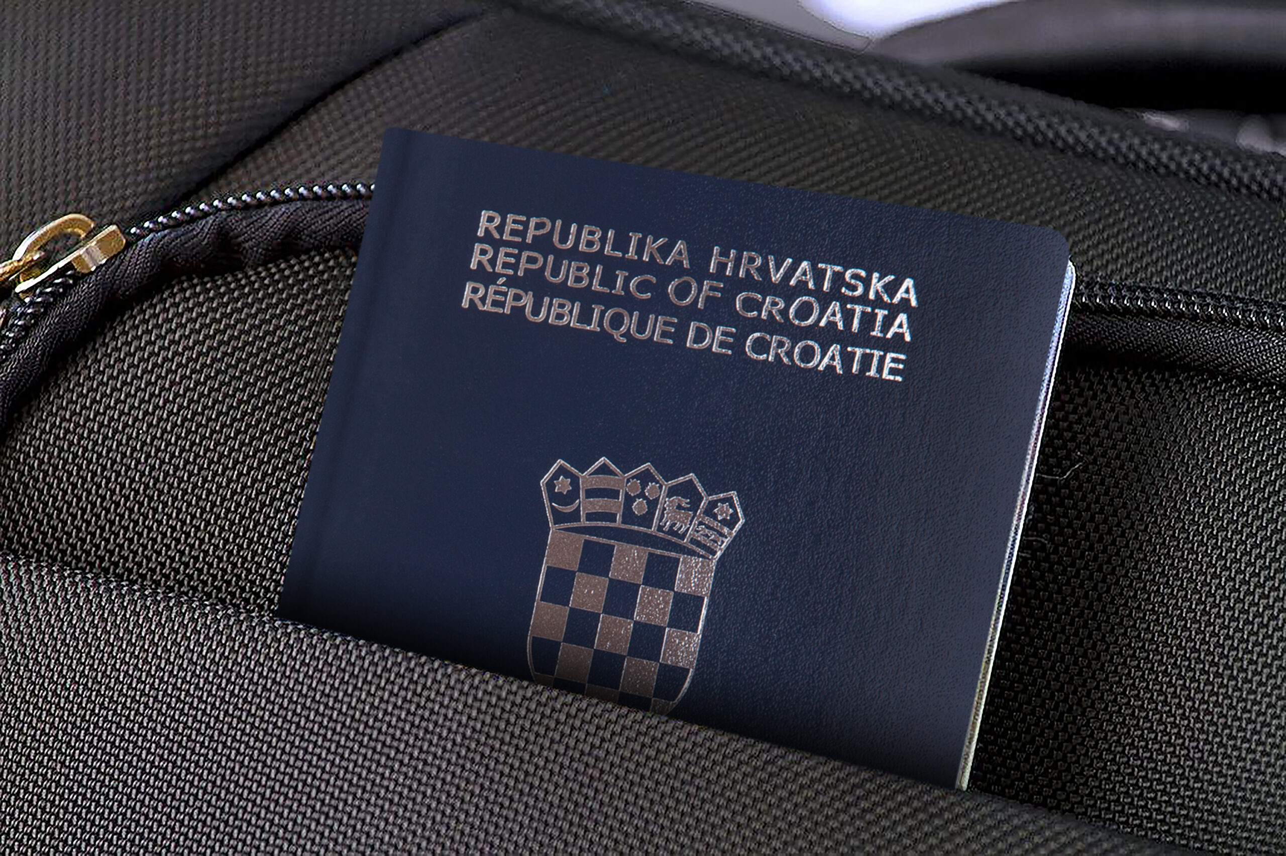 Croatian Passport tucked into a laptop bag pocket