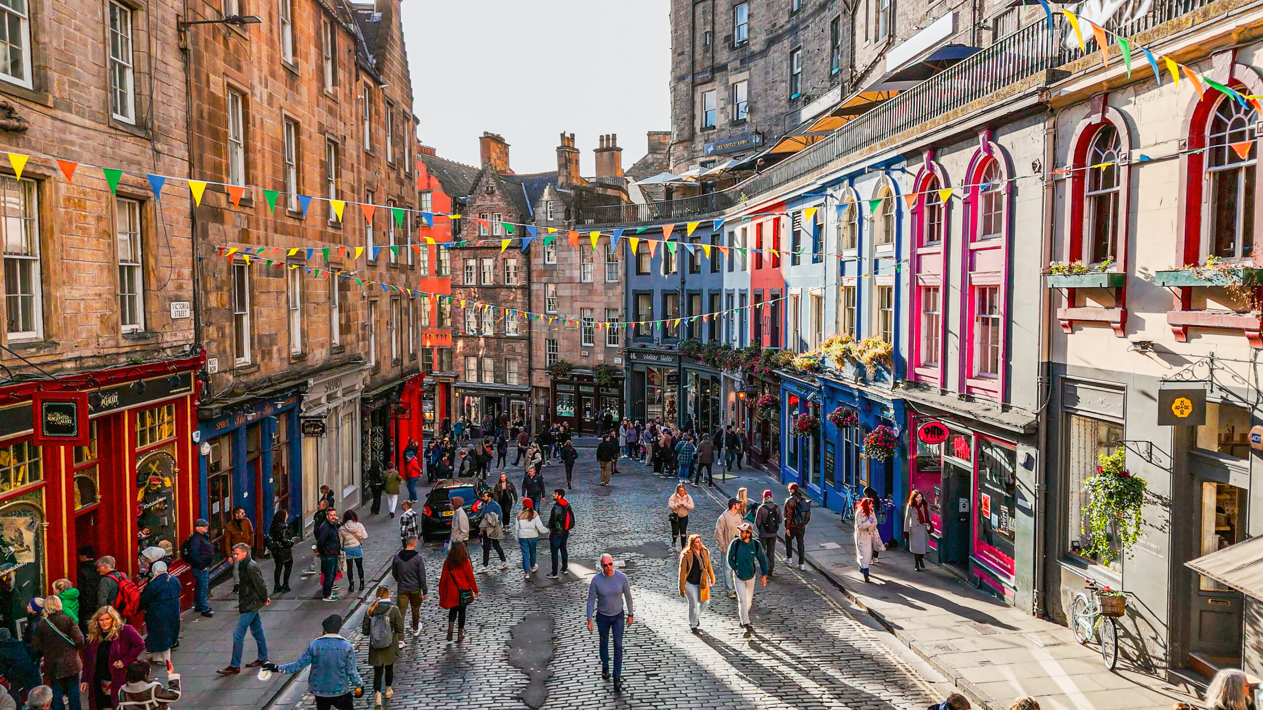 Aerial view of the famous colorful Victoria Street in the Old Town of Edinburgh, Scotland