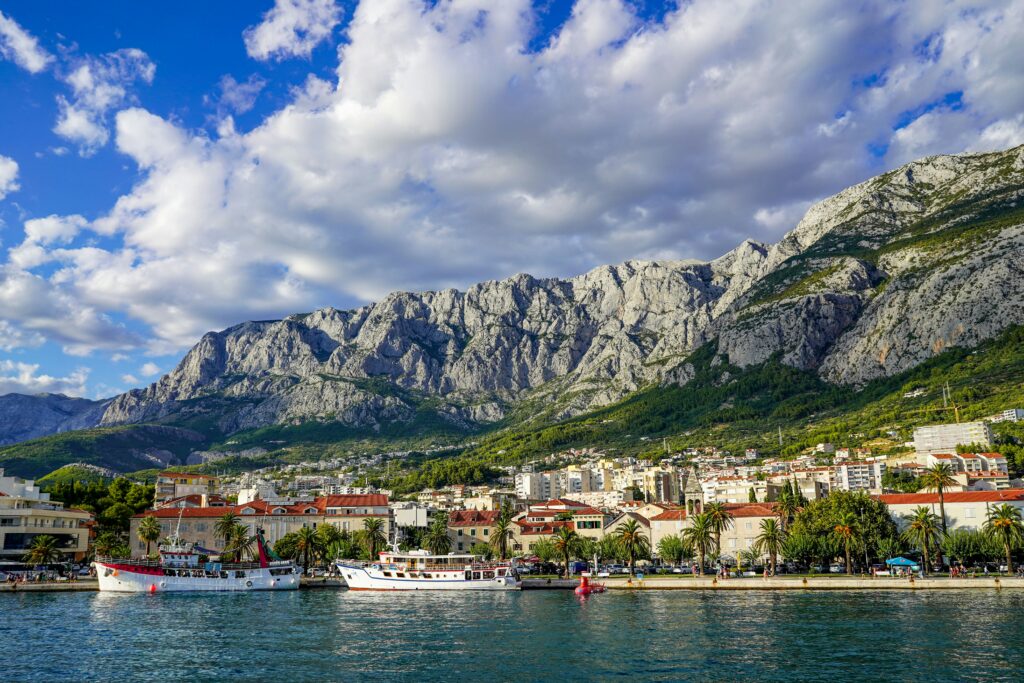 View of a seaside village in Croatia with mountains in the background