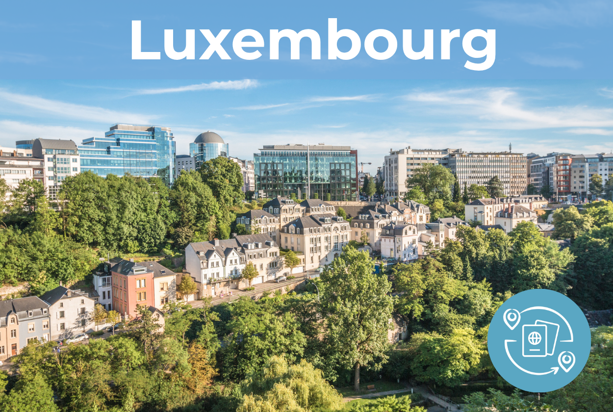 Aerial view of a street in Luxembourg with modern buildings in the background. Text: Luxembourg